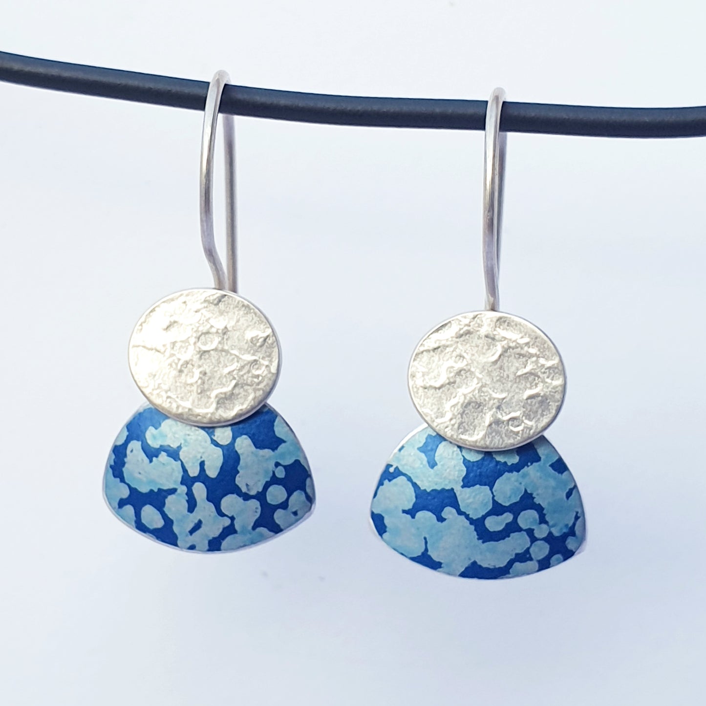 LCH2 Little silver oval drop earrings with patterned anodised aluminium skirt