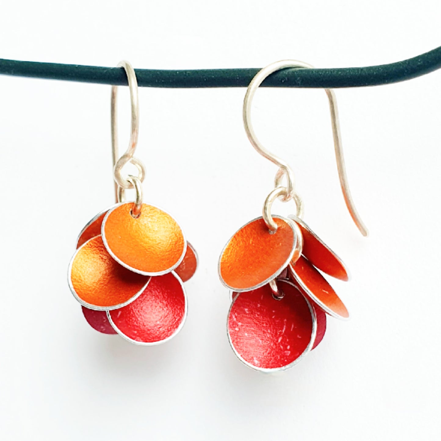 CD18 Six concave disc drop earrings
