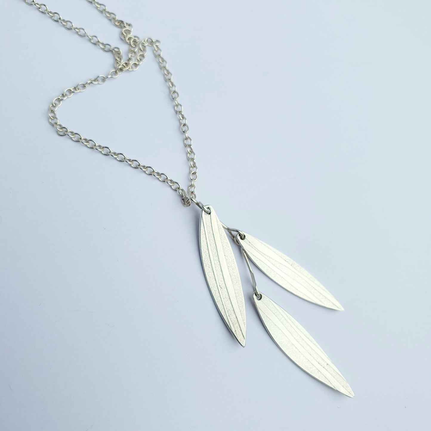 SL25 Three silver leaf cascade pendant on long chain
