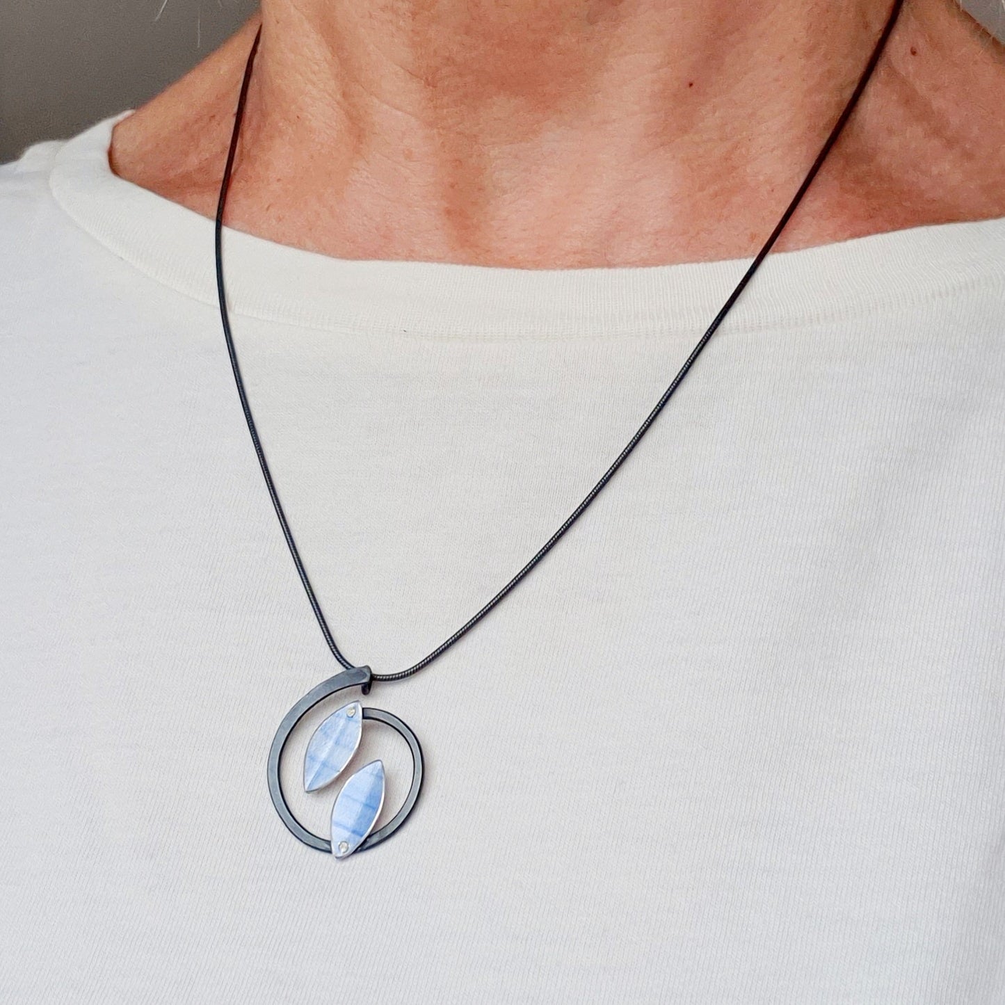 SL18 Light blue leaves on black stem pendant