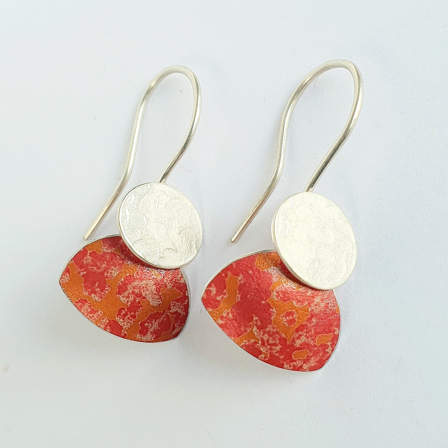 LCH2 Little silver oval drop earrings with patterned anodised aluminium skirt
