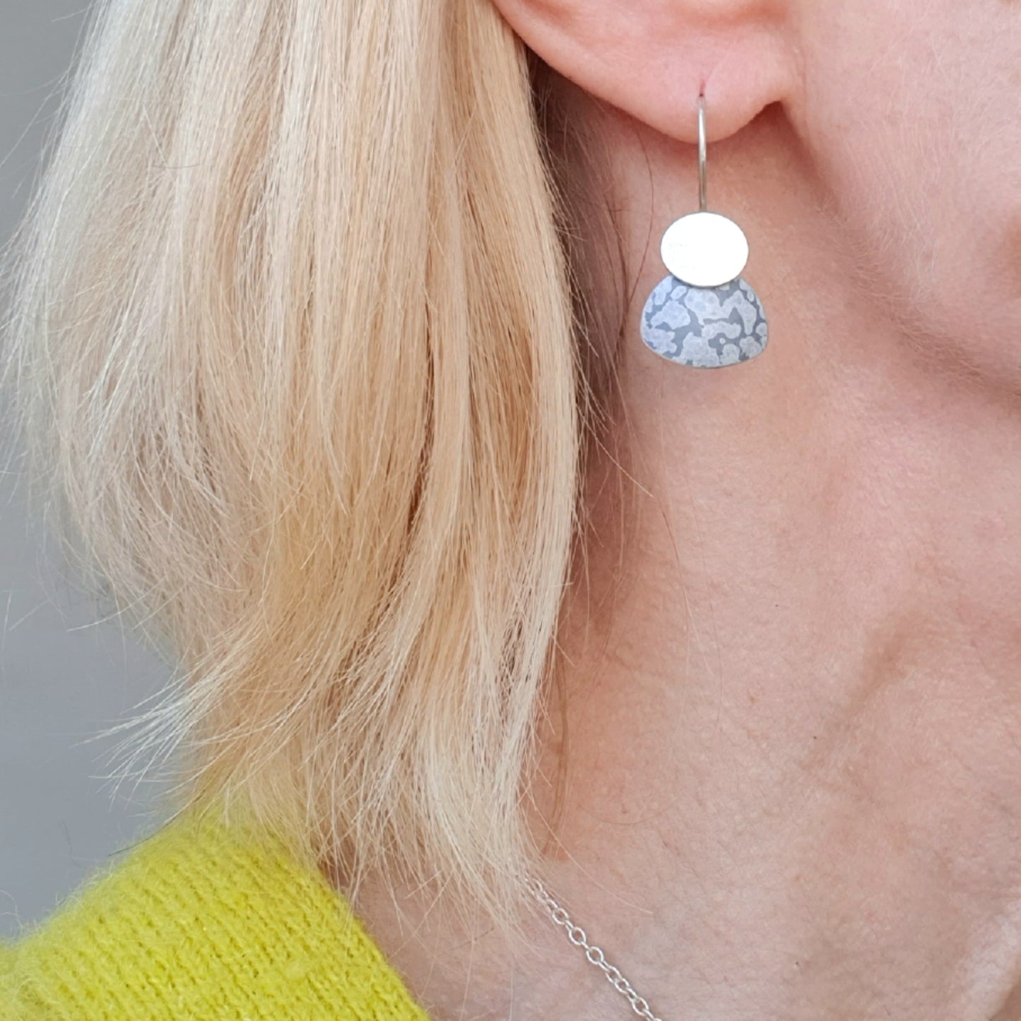 LCH2 Little silver oval drop earrings with patterned anodised aluminium skirt