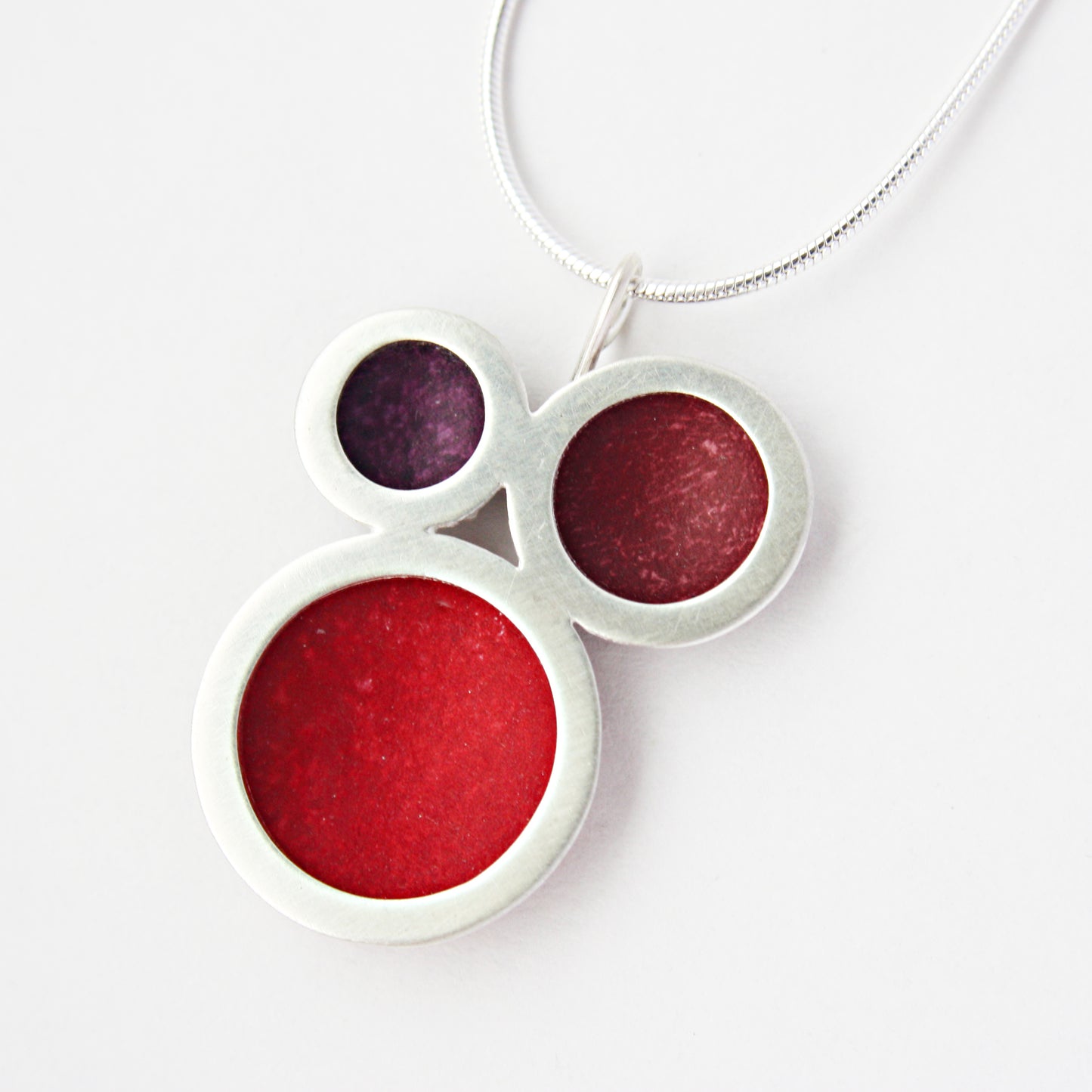 SL26 Triple orbit pendant in red, burgundy and berry
