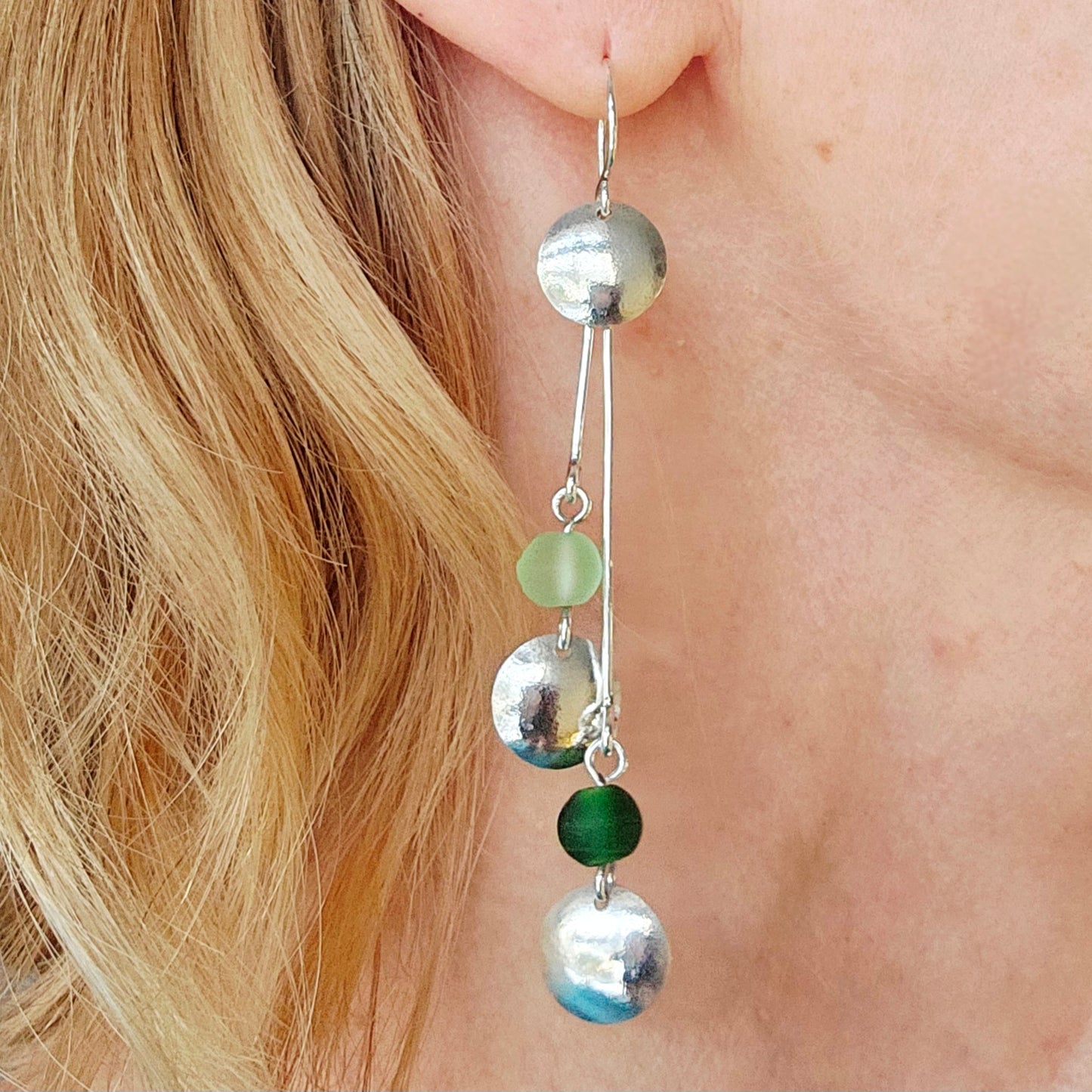 SL16 Silver double disc drop earrings with light and dark green glass beads