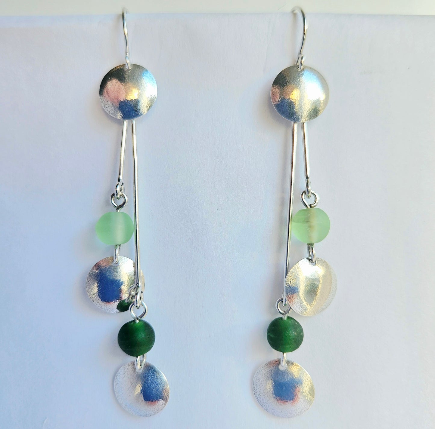 SL16 Silver double disc drop earrings with light and dark green glass beads