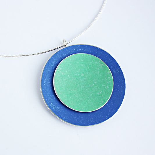 Large double concave disc pendant in royal blue and green